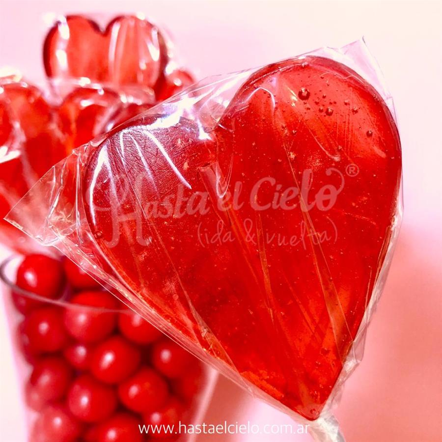 PALETAS DE CARAMELO CORAZON 6CM ROJO TRANSLUCIDO.